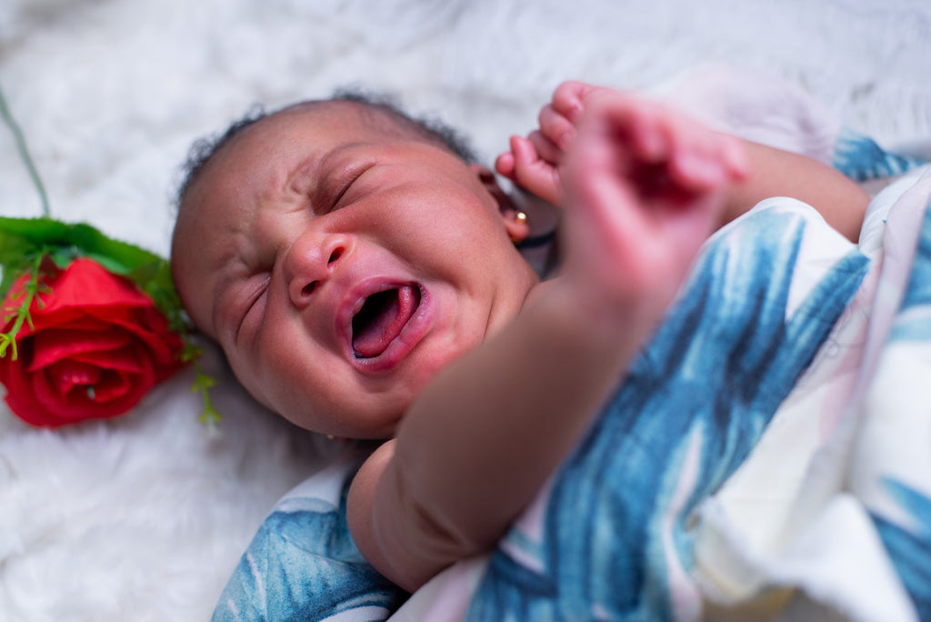 Is it OK To Hold Your Newborn Every Time He Cries?